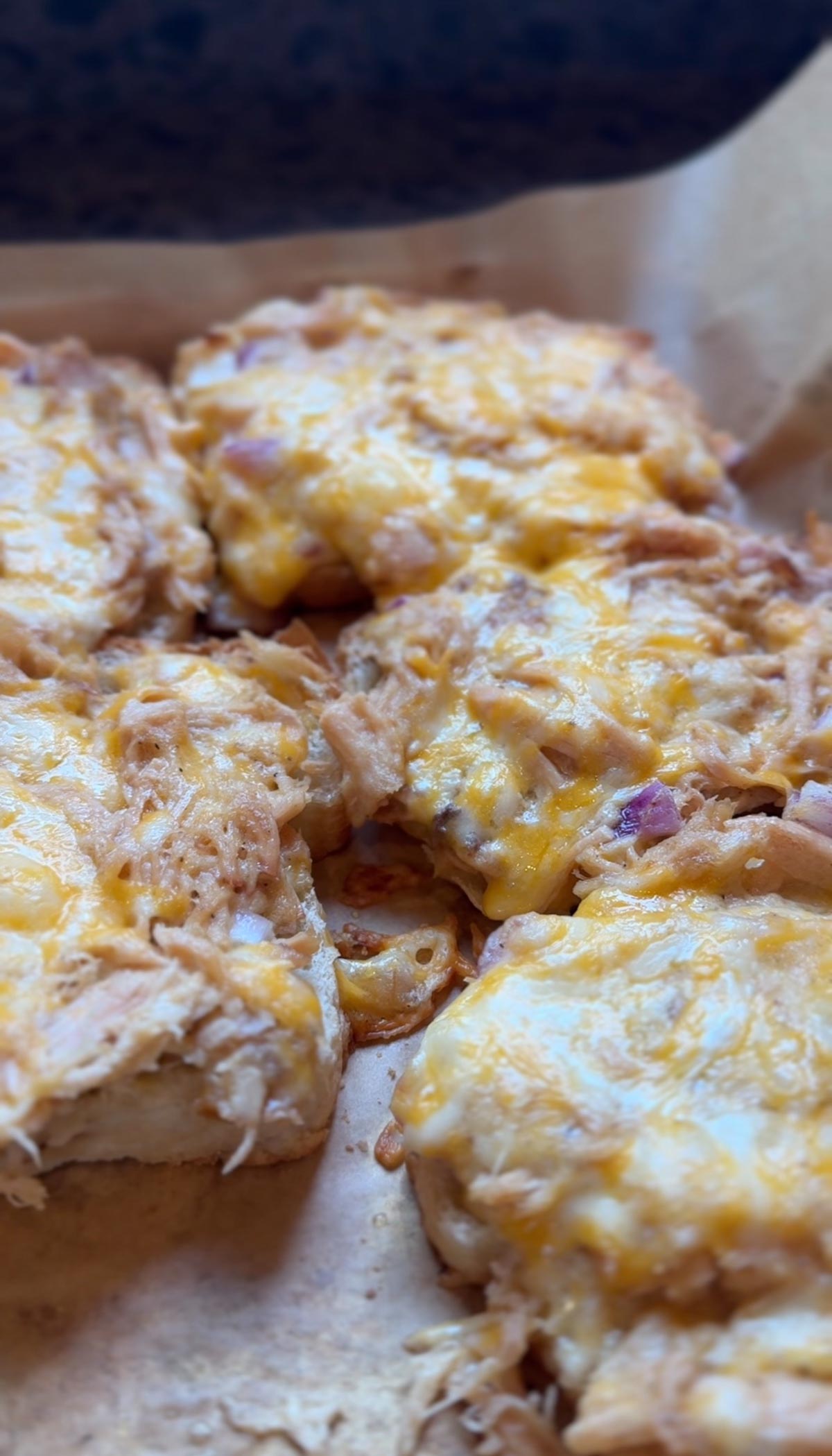 golden brown chicken melts on baking sheet fresh from the oven