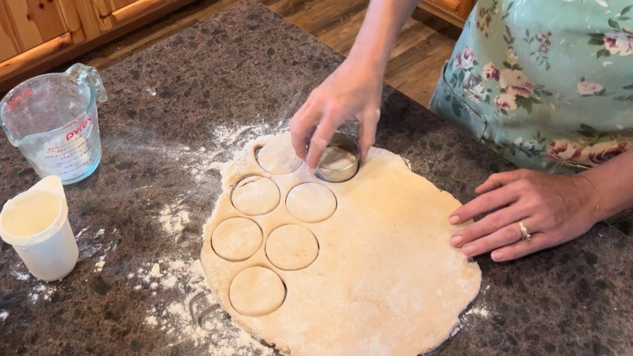 cutting biscuits for sourdough peach cobbler