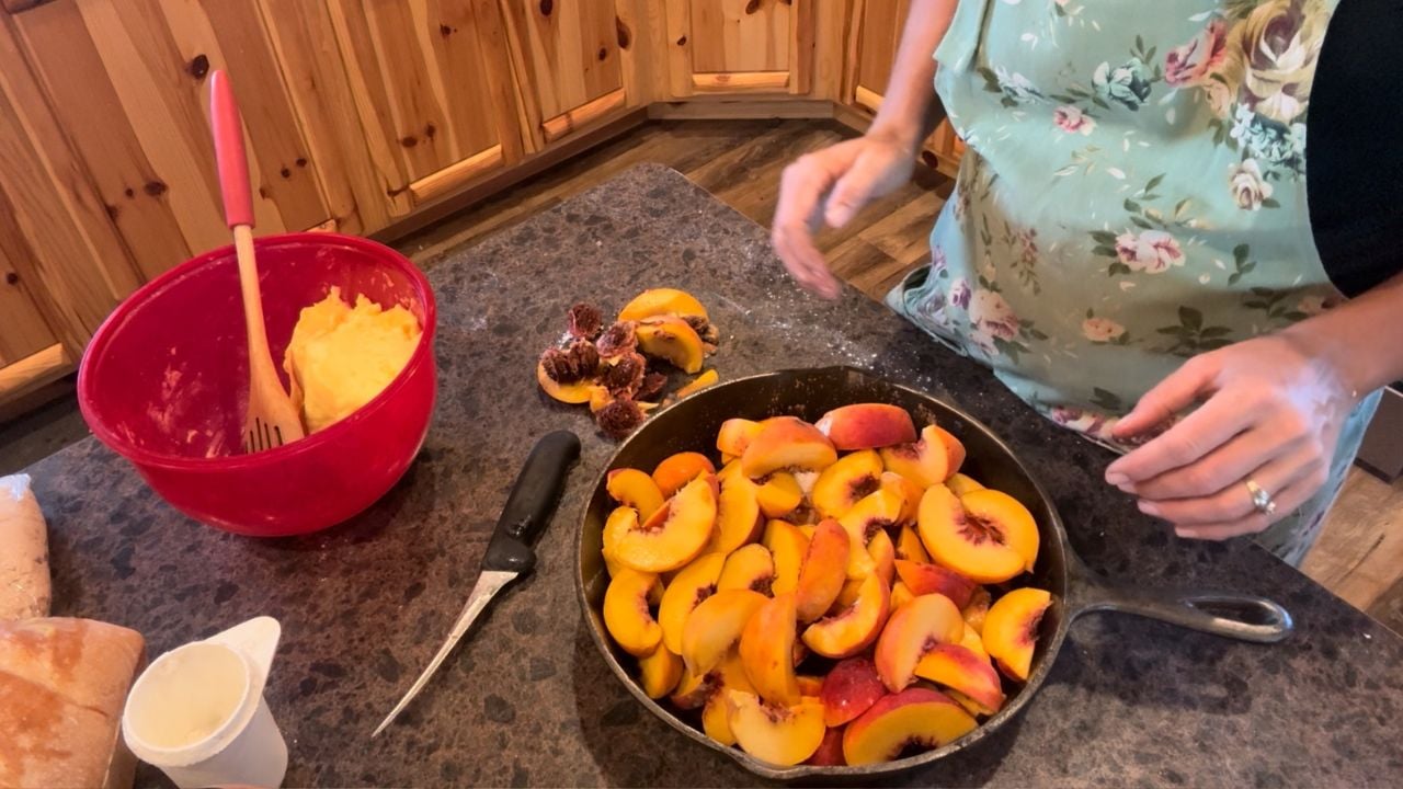 sourdough peach cobbler in cast iron skillet