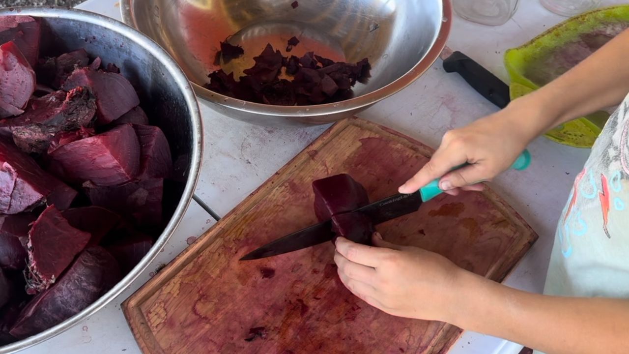 chopping up cooked beets for canned pickled beets