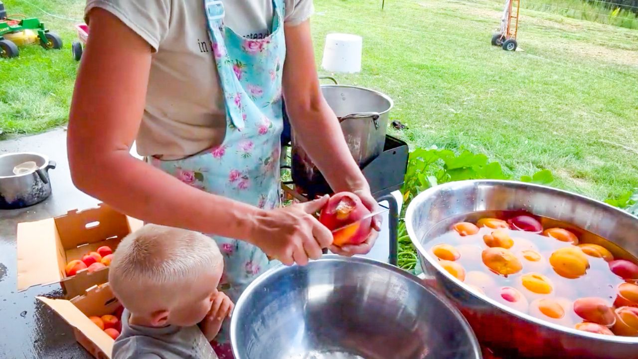 lady canning peaches