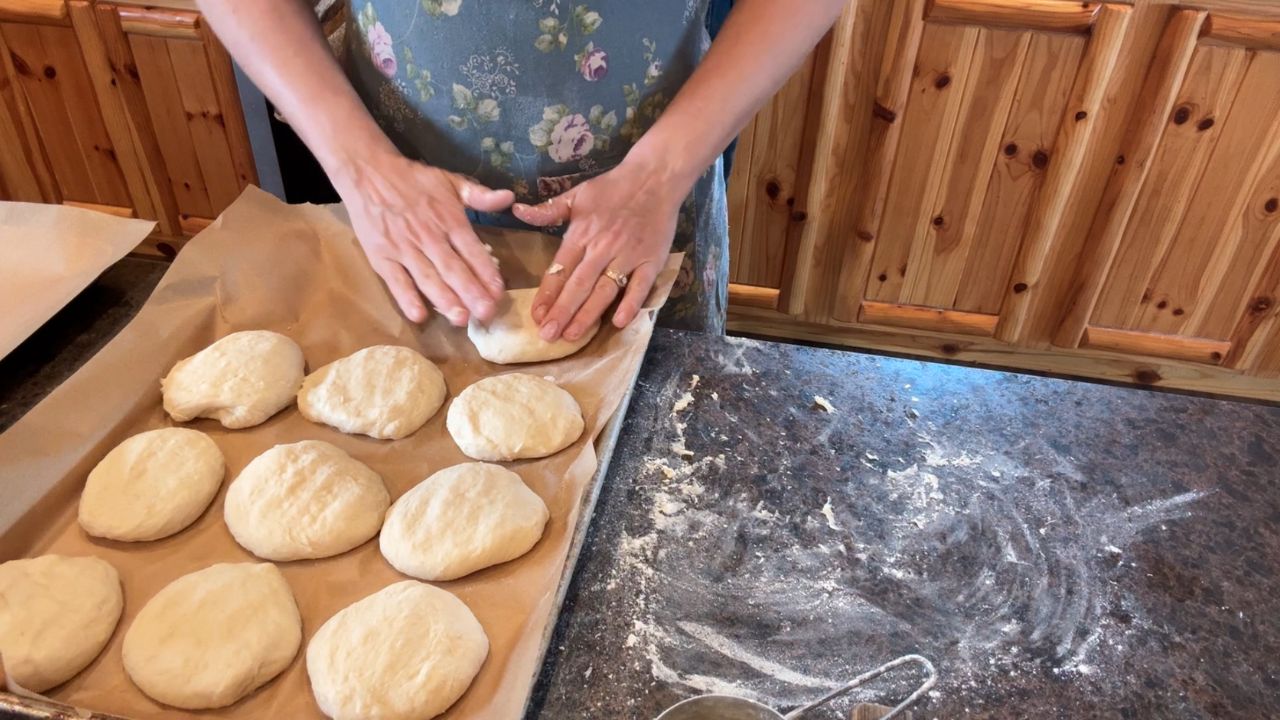 shaping sourdough hamburger buns