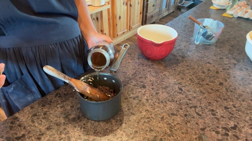 mixing up chocolate, butter and vanilla for brownies