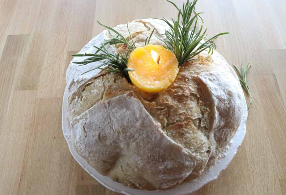 butter candle in sourdough with rosemary closeup horizontal