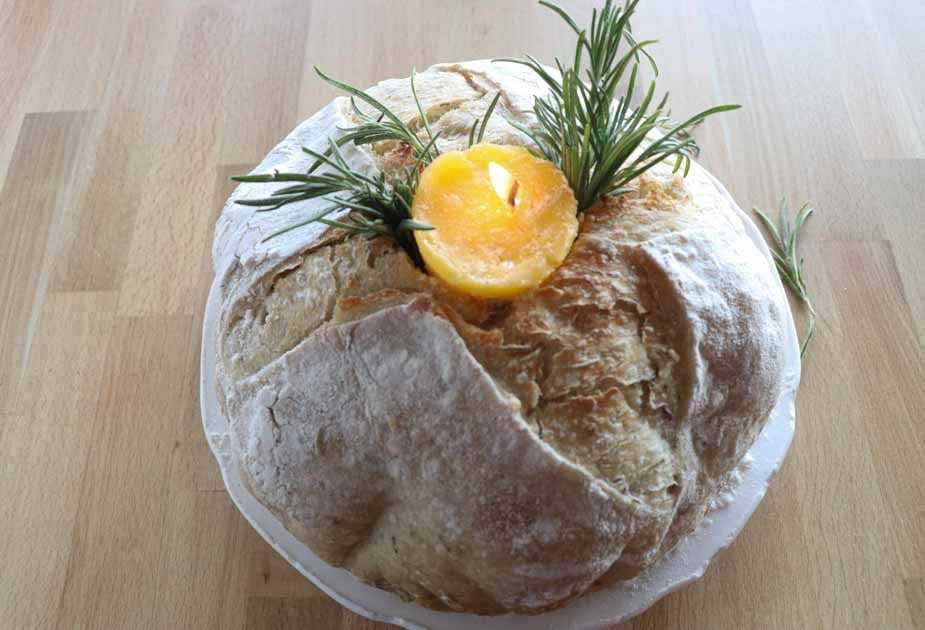 lit butter candle in sourdough