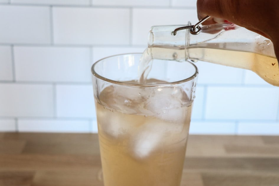 pouring a glass of water kefir