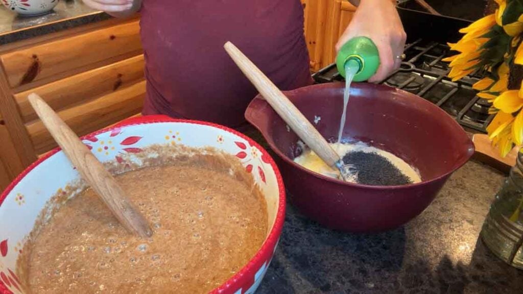 adding lemon juice to lemon poppy seed zucchini bread