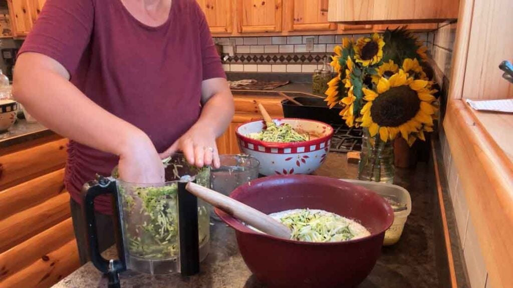 adding zucchini to sourdough zucchini bread