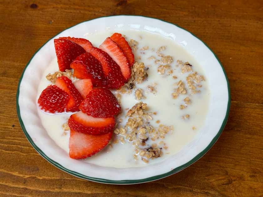 bowl of sourdough granola with milk