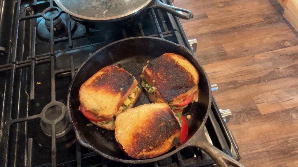 cooking tomato pesto grilled cheese sandwich