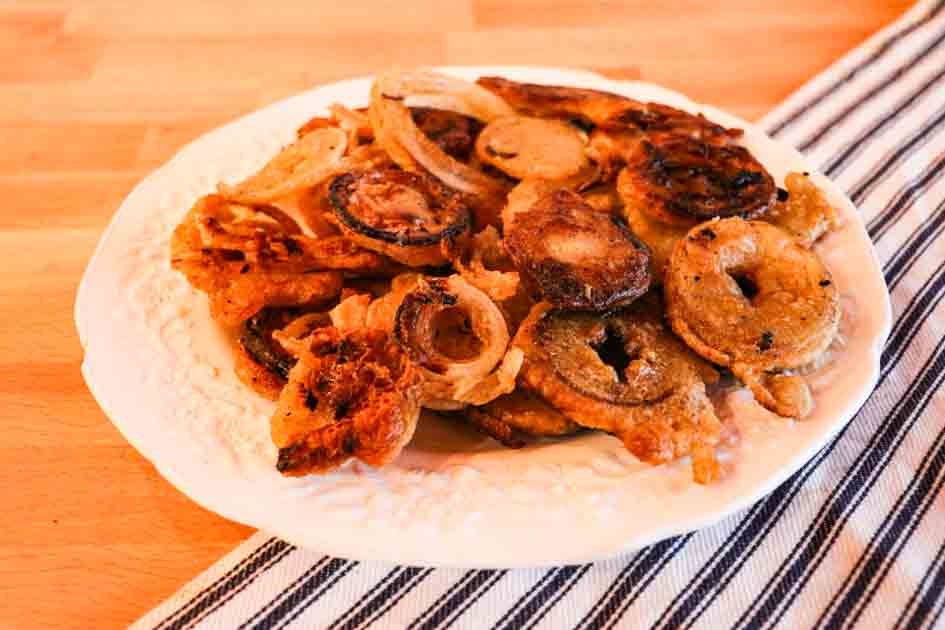 delicious plate of sourdough onion rings side view