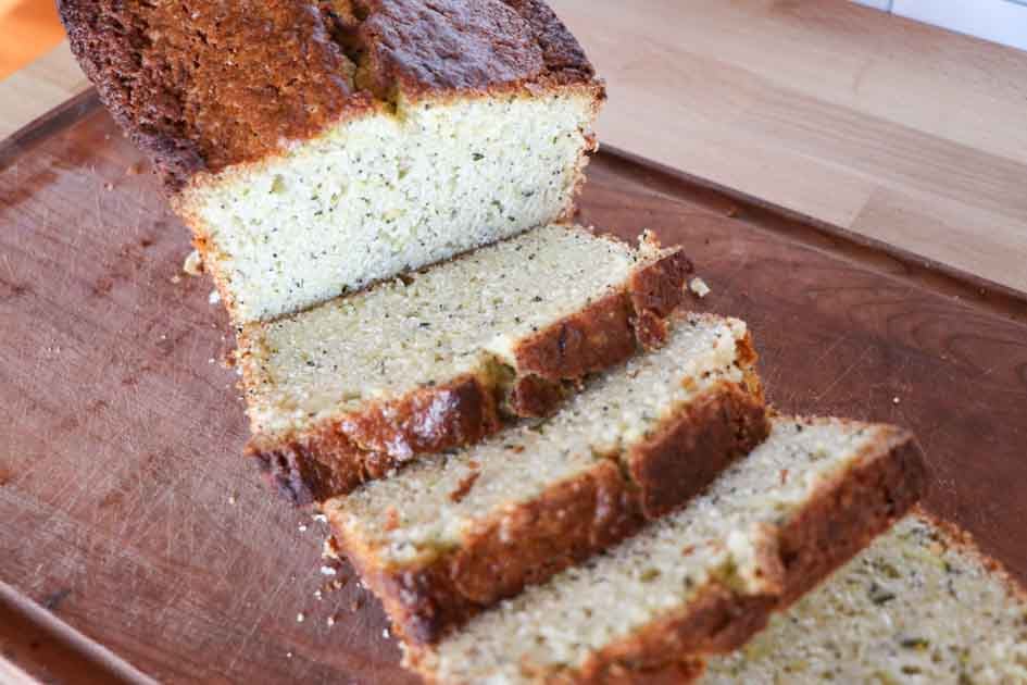 lemon zucchini bread sliced on a cutting board