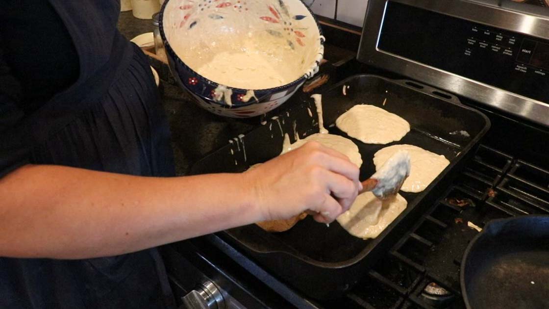 making pumpkin pancakes on a cast iron skillet