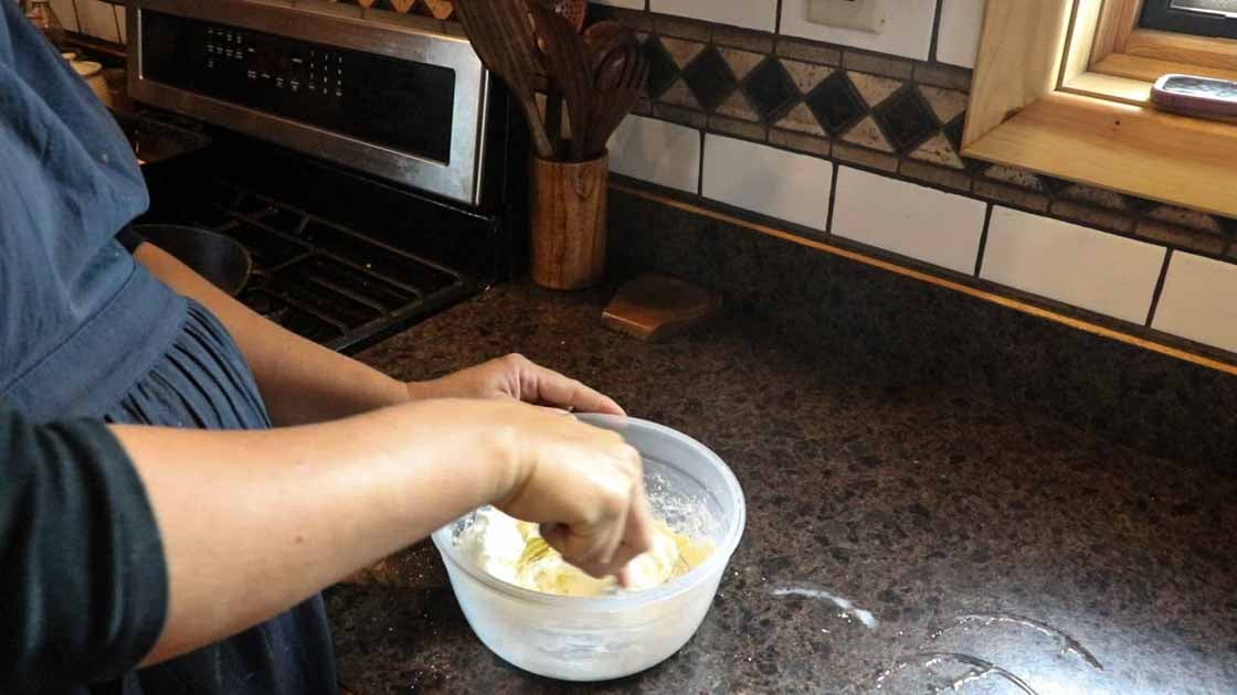 mixing up cream cheese for pumpkin muffins