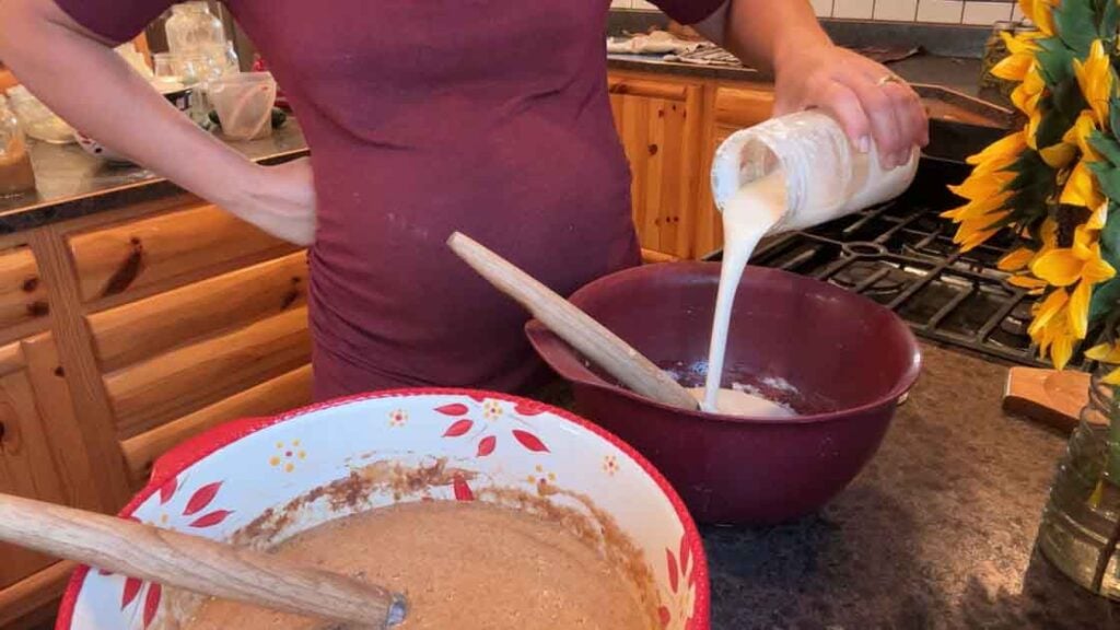 mixing up lemon poppy seed zucchini bread