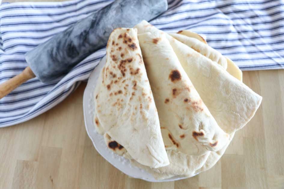 sourdough tortillas with rolling pin and towel