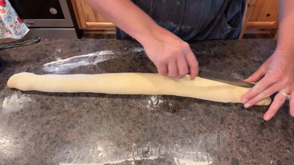 starting to cut sourdough cinnamon twist