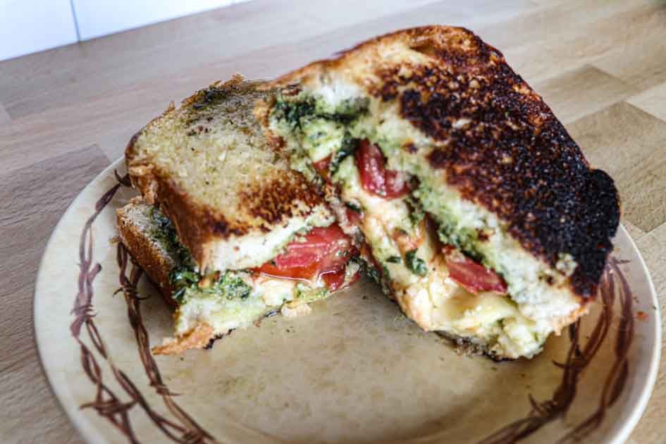 tomato pesto grilled cheese sandwich on plate
