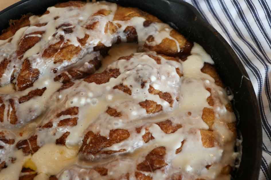 pan of pumpkin focaccia with frosting close up
