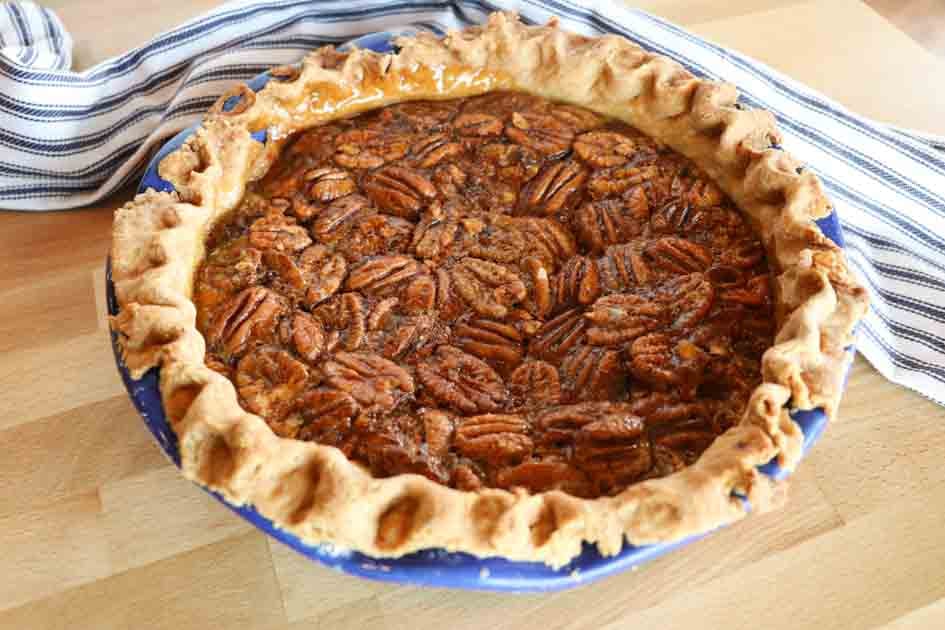 whole maple pecan pie with towel