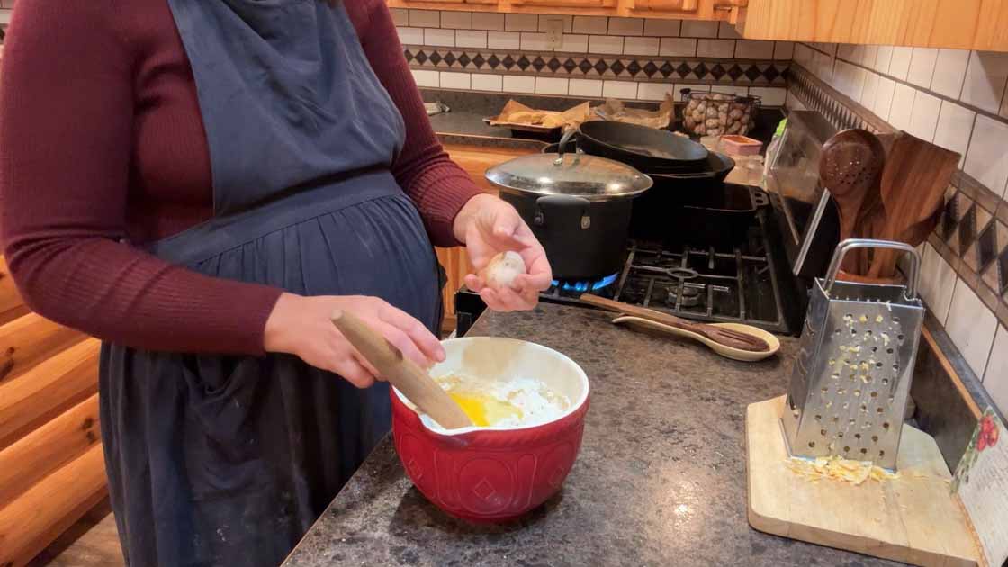 adding eggs to sourdough cornbread