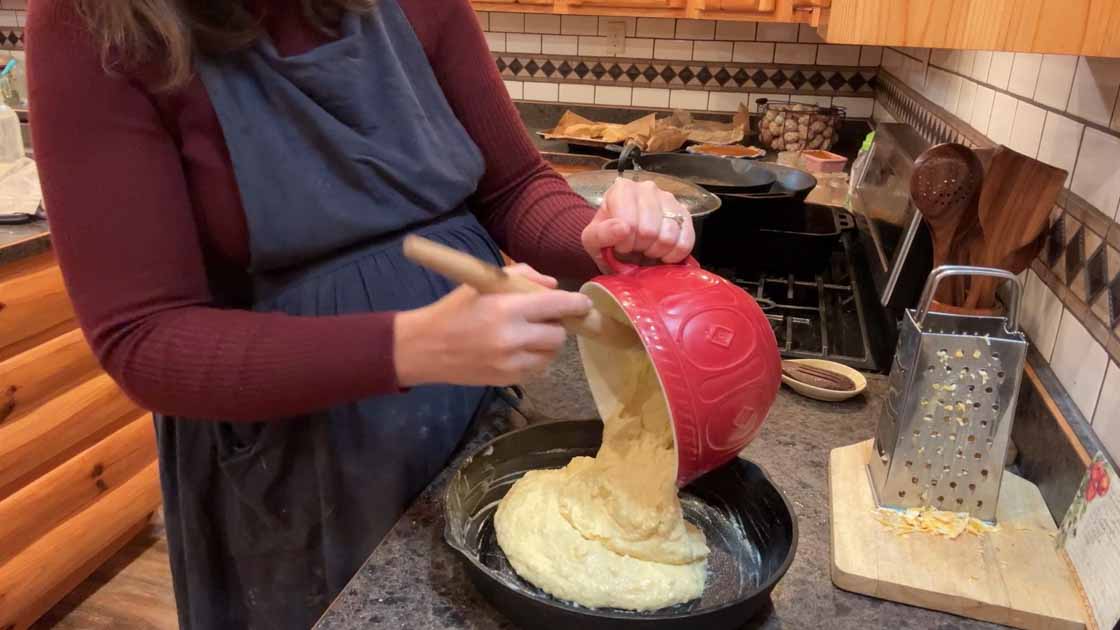 adding sourdough cornbread to skillet