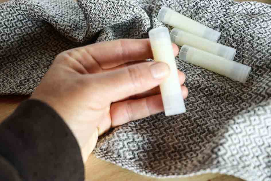 lady holding tallow lip balm