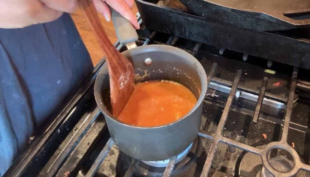 making caramel for cinnamon rolls