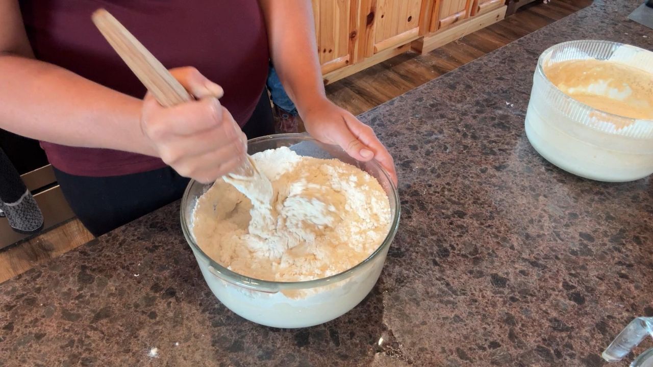 mixing up dough for cinnamon raisin sourdough bread