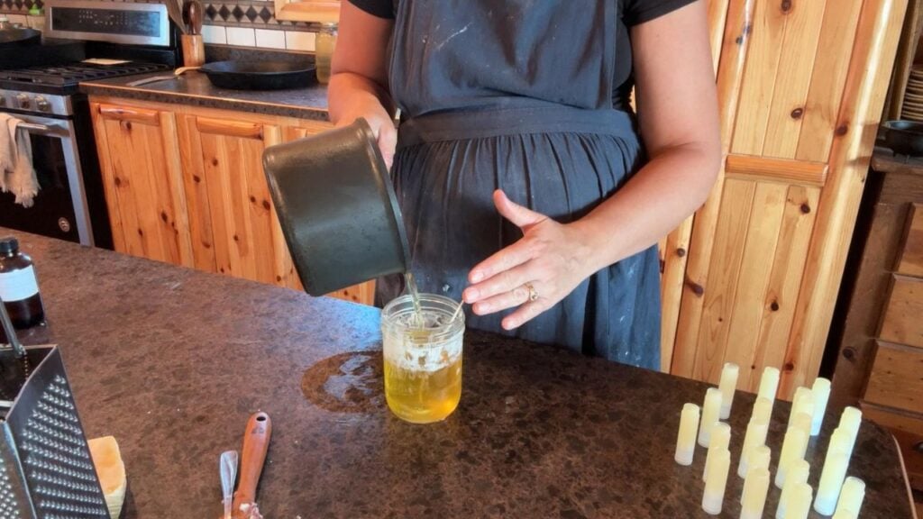 pouring a tallow candle