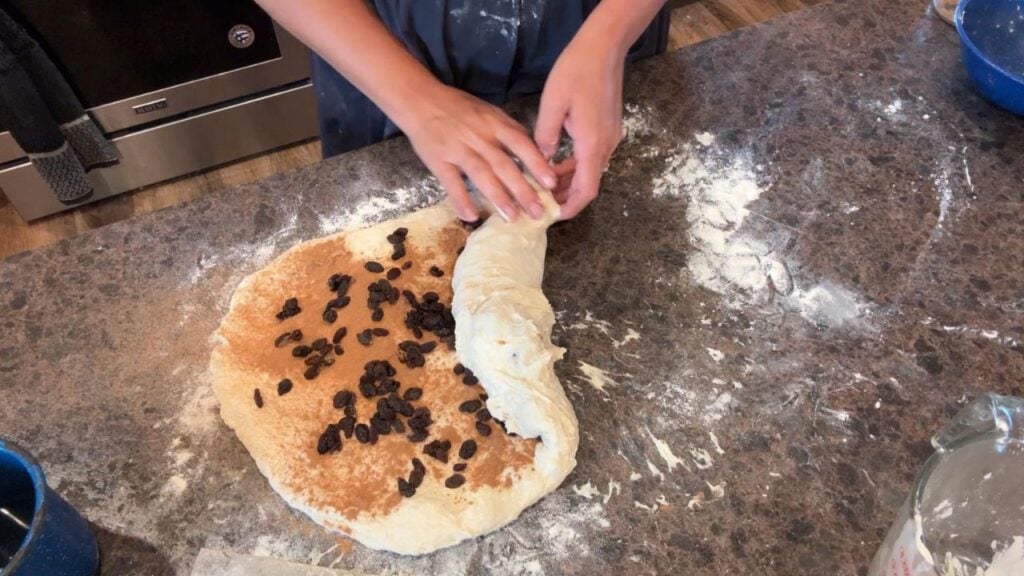shaping cinnamon raisin sourdough bread