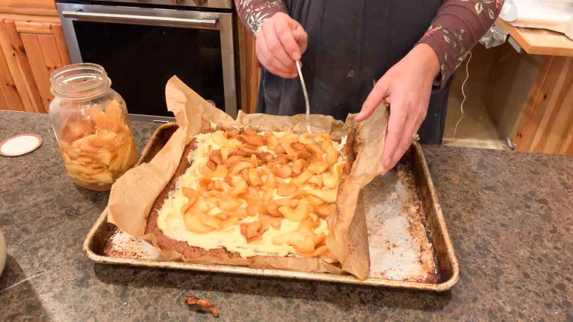 adding apple pie filling to apple cake roll