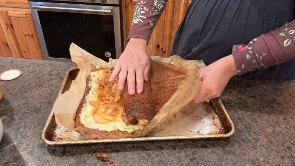 rolling up sourdough apple cake roll