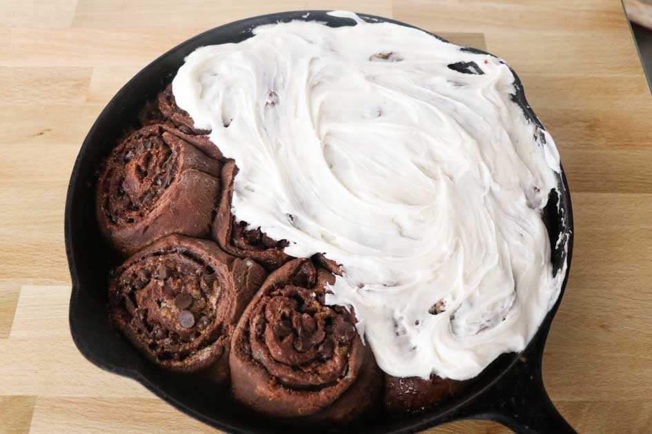 chocolate cinnamon rolls with frosting up close