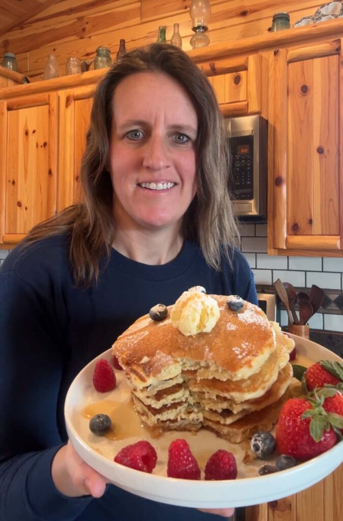 Lady holding sourdough pancakes