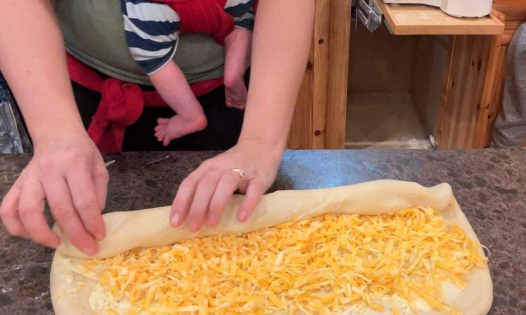 rolling up garlic cheese rolls