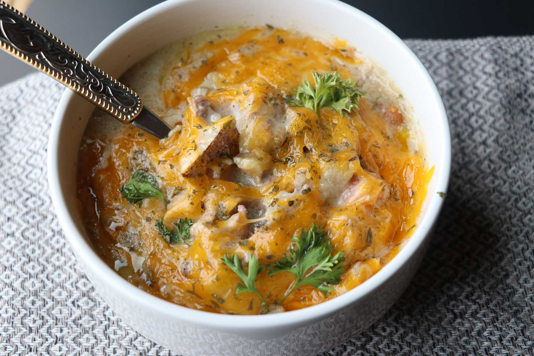 bowl of cheeseburger soup on towel