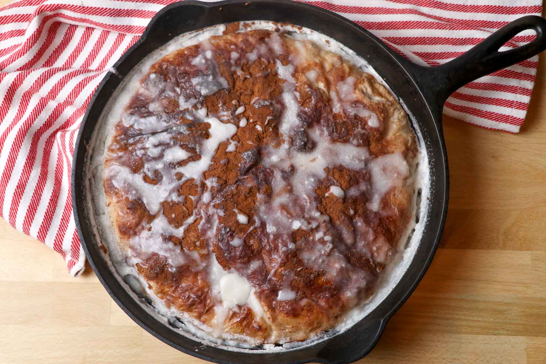 cast iron pan of cinnamon roll focaccia