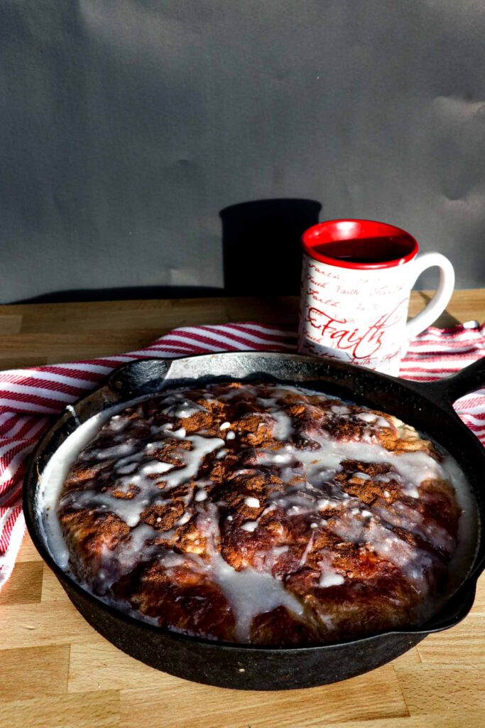 cinnamon roll focaccia with coffee on black