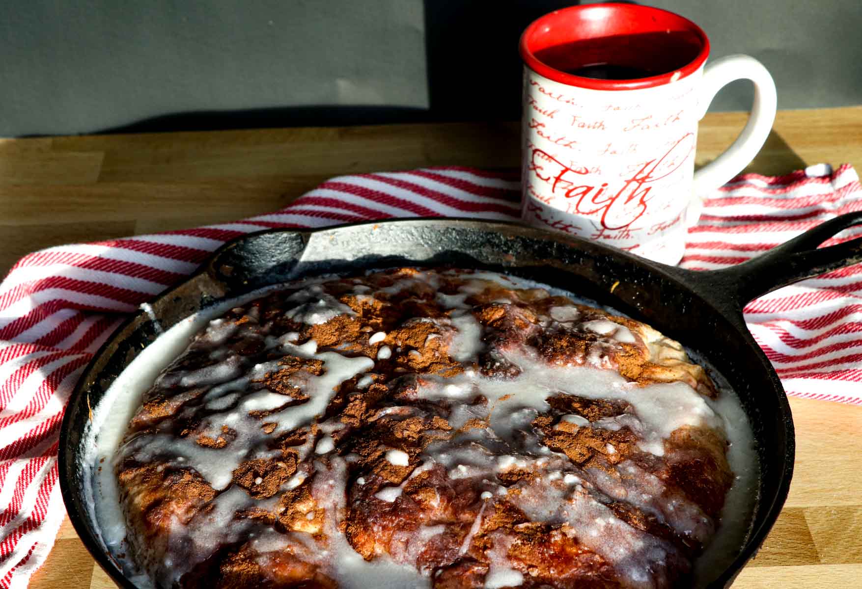 cinnamon roll focaccia with coffee on black horizontal