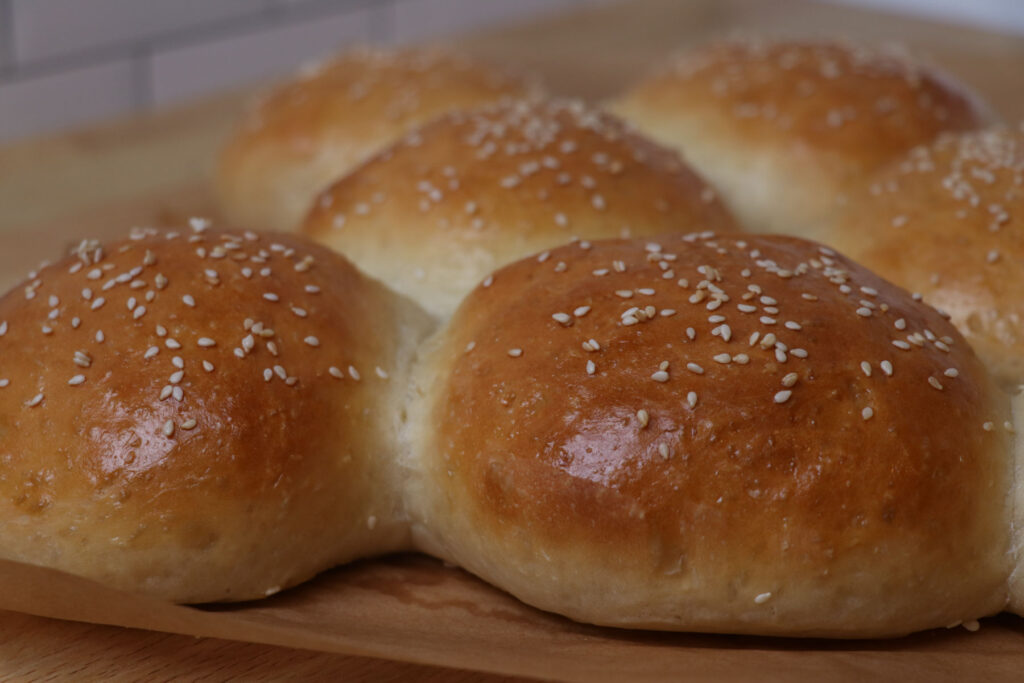 fresh baked sourdough hamburger buns side view