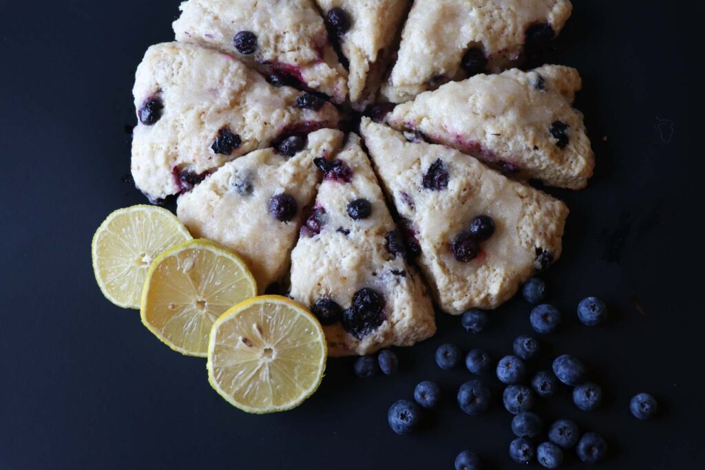 lemon blueberry sourdough scones on black
