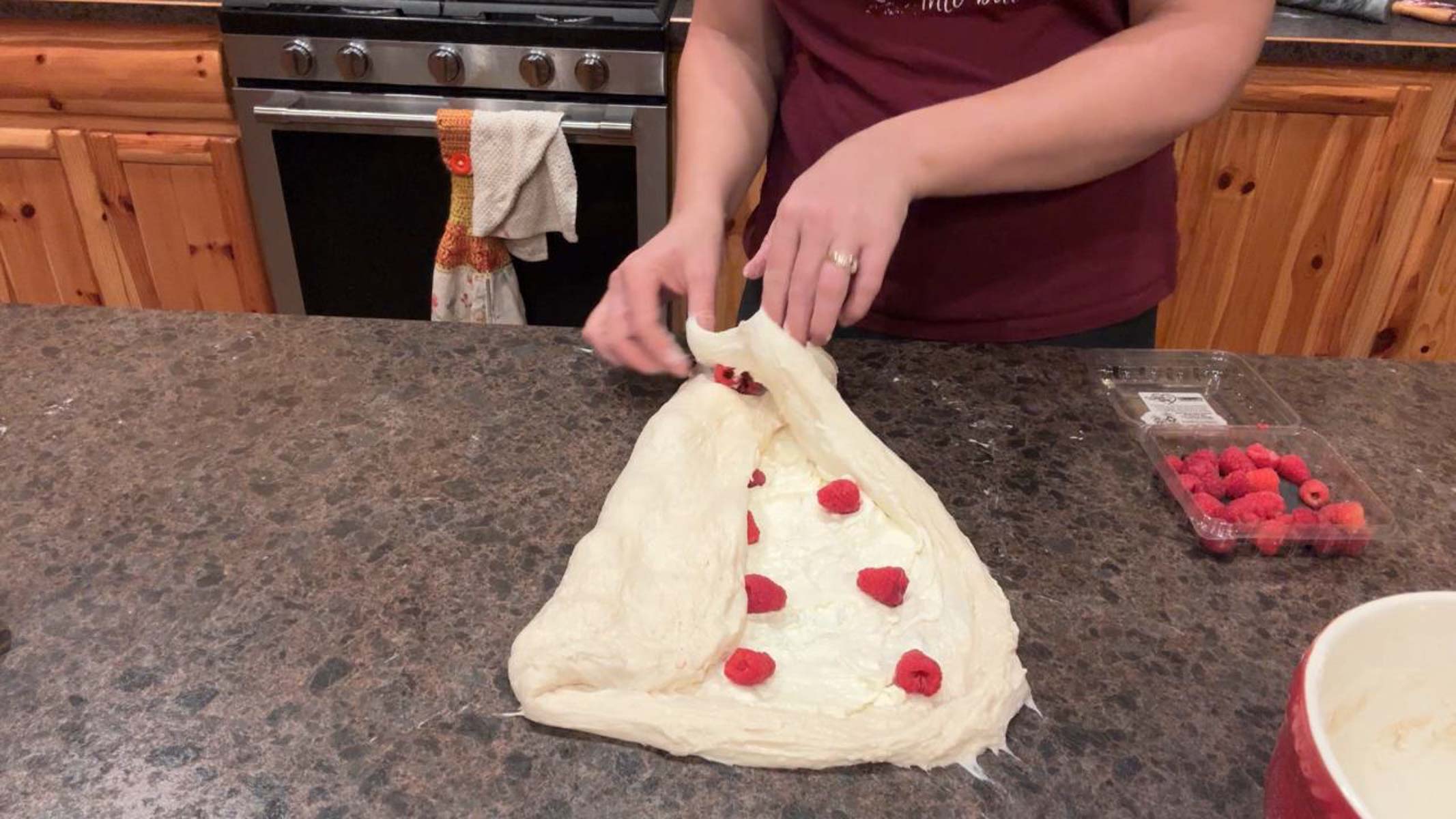shaping raspberry cheesecake sourdough