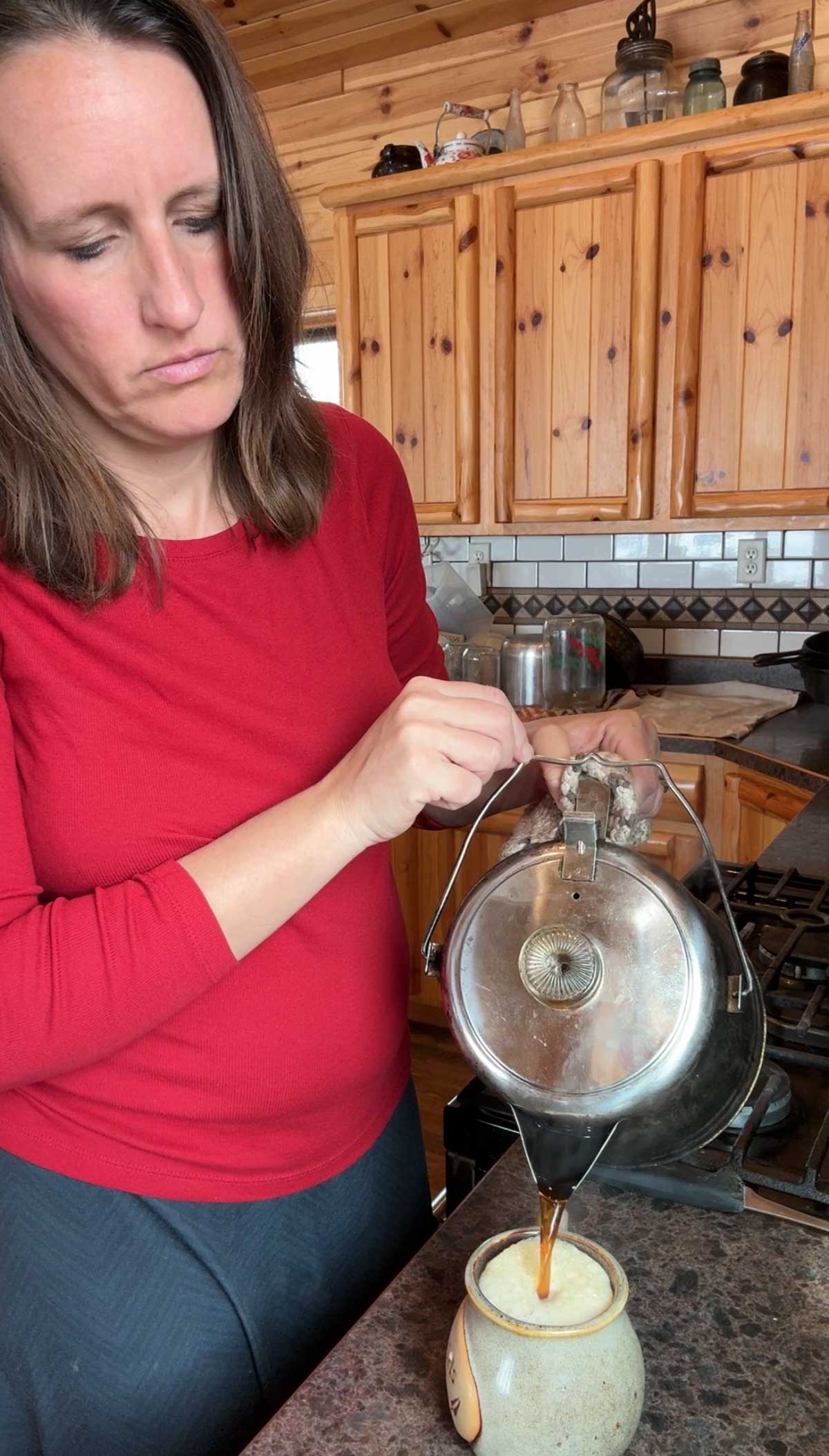 lady pouring coffee into a cup