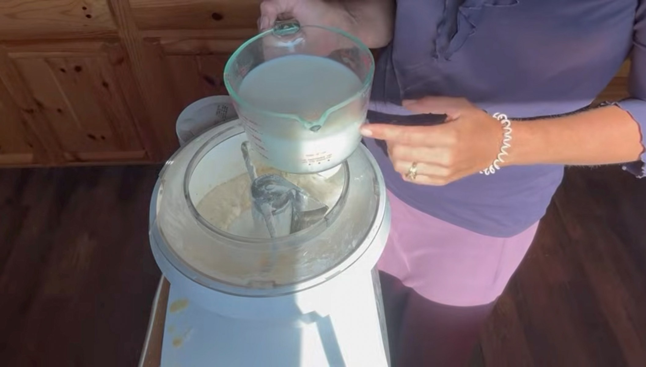 adding more ingredients to sourdough bread