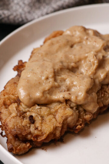 chicken fried steak and gravy on plate