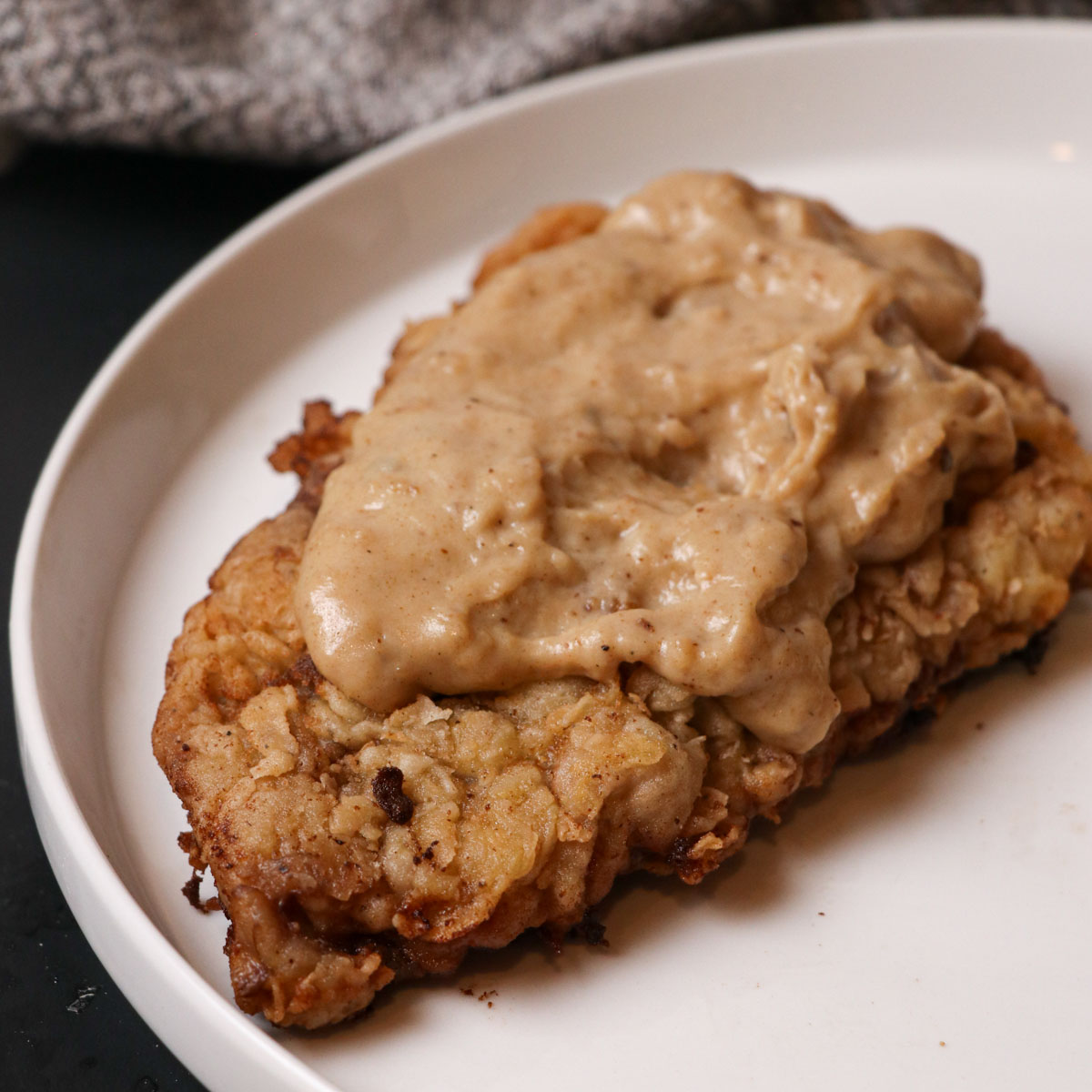 chicken fried steak and gravy on plate