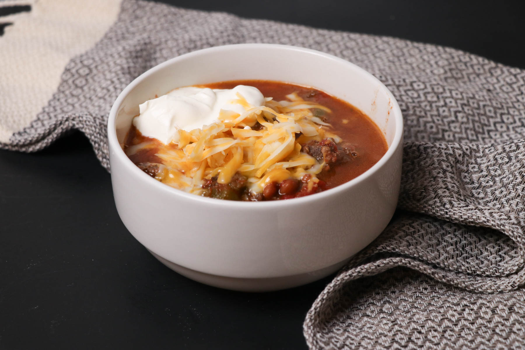 bowl of cowboy chili by towel
