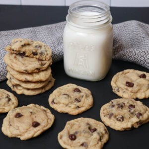 fresh baked chocolate chip cookies with milk square