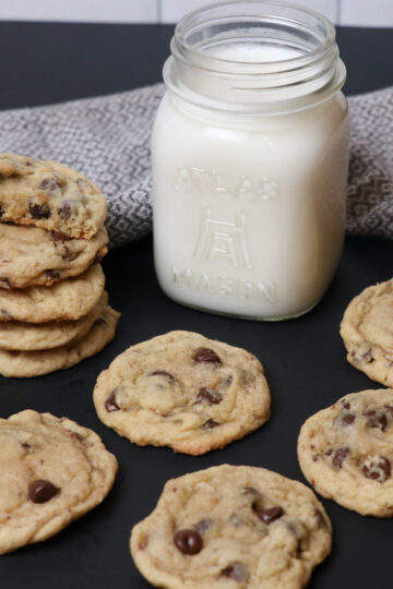 fresh baked chocolate chip cookies with milk square